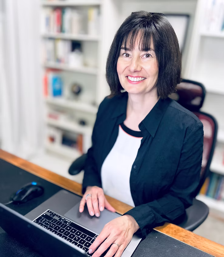 Laurence coaching at her desk